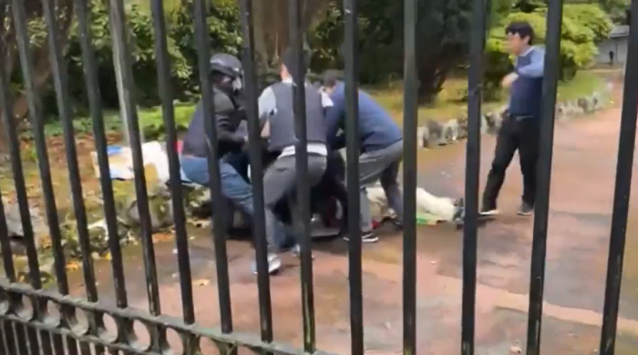 Bob Chan is beaten inside the grounds of the Chinese consulate in Manchester, UK.