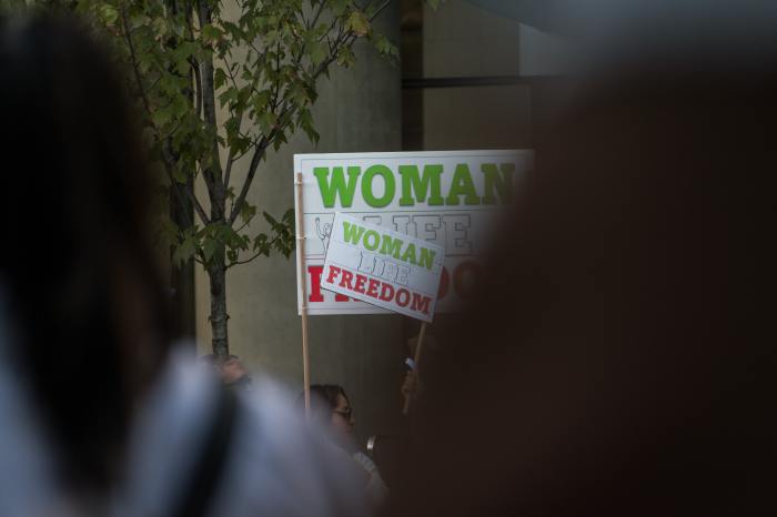 A protester holds a sign that reads 'Woman Life Freedom' during demonstrations following the following the death of Iranian woman Zhina ‘Mahsa’ Amini.