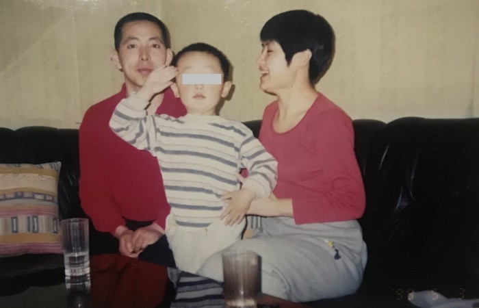 Fang Bin with his wife and son in an undated photo.